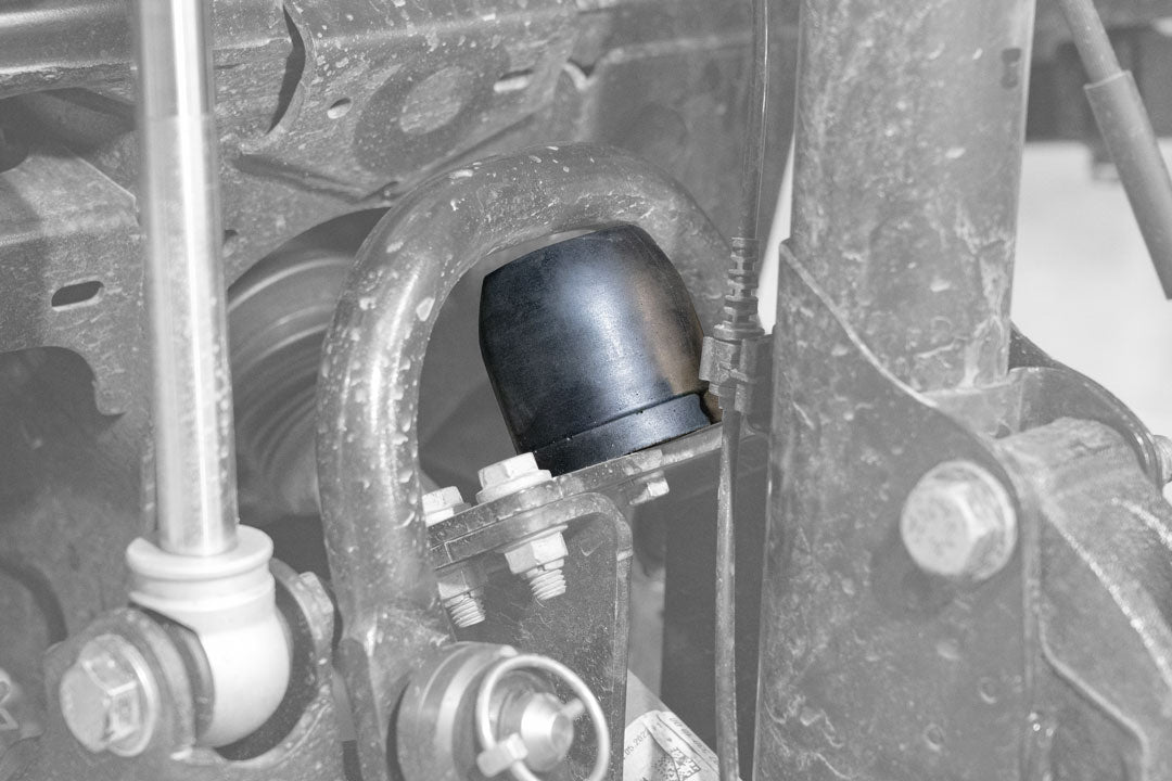 BUMP BUDDIES FRONT JOUNCE STOPS - SPRINTER AWD & 4X4 (2015+ 2500 and 3500) PAIR: Close-up of metal and foam jounce stops, showcasing cylindrical design and mounting plate.