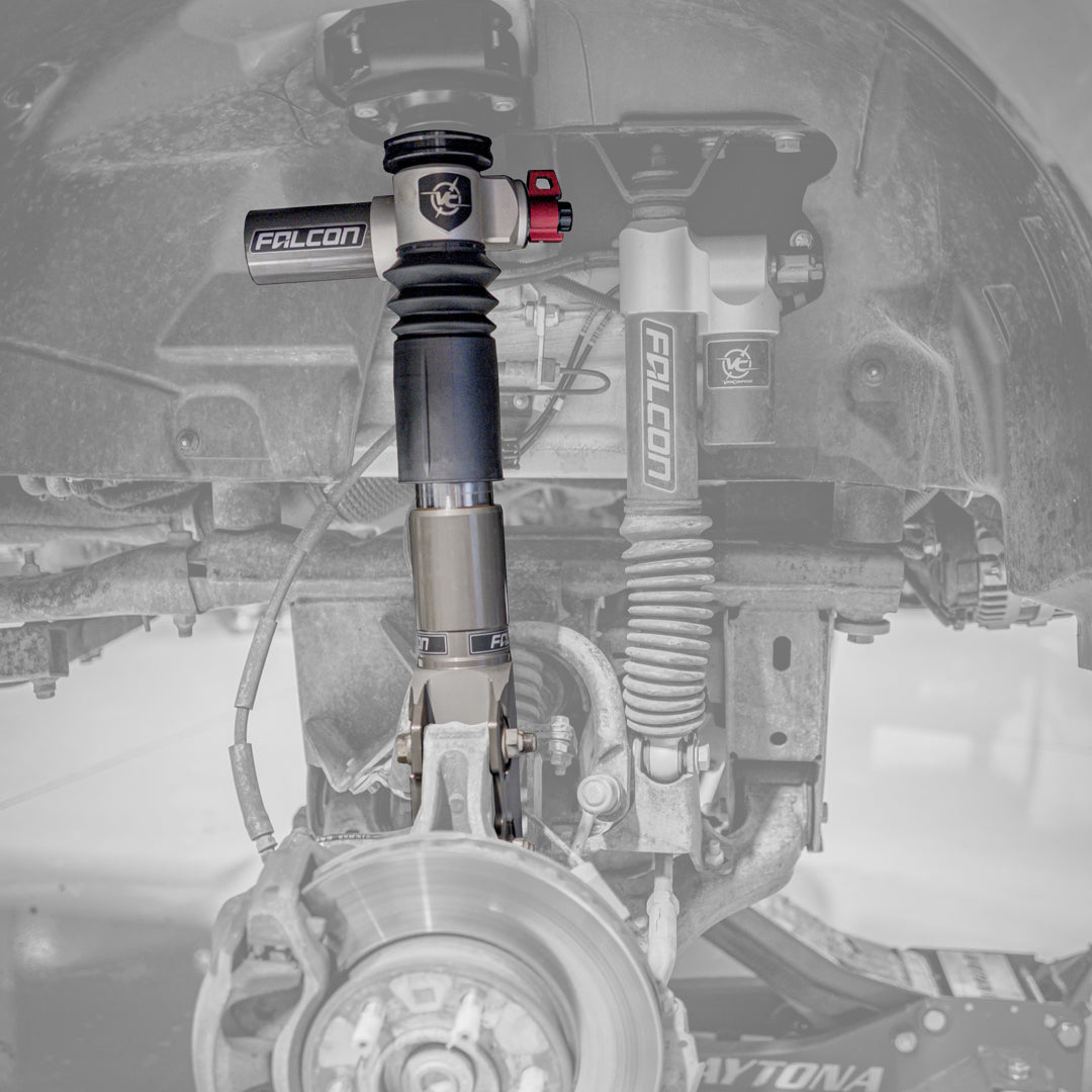 Close-up of VAN COMPASS Falcon 3.3 Fast Adjust Inverted Rally Strut for 2015-Present Sprinter 4x4 and AWD, highlighting advanced suspension technology and robust construction.