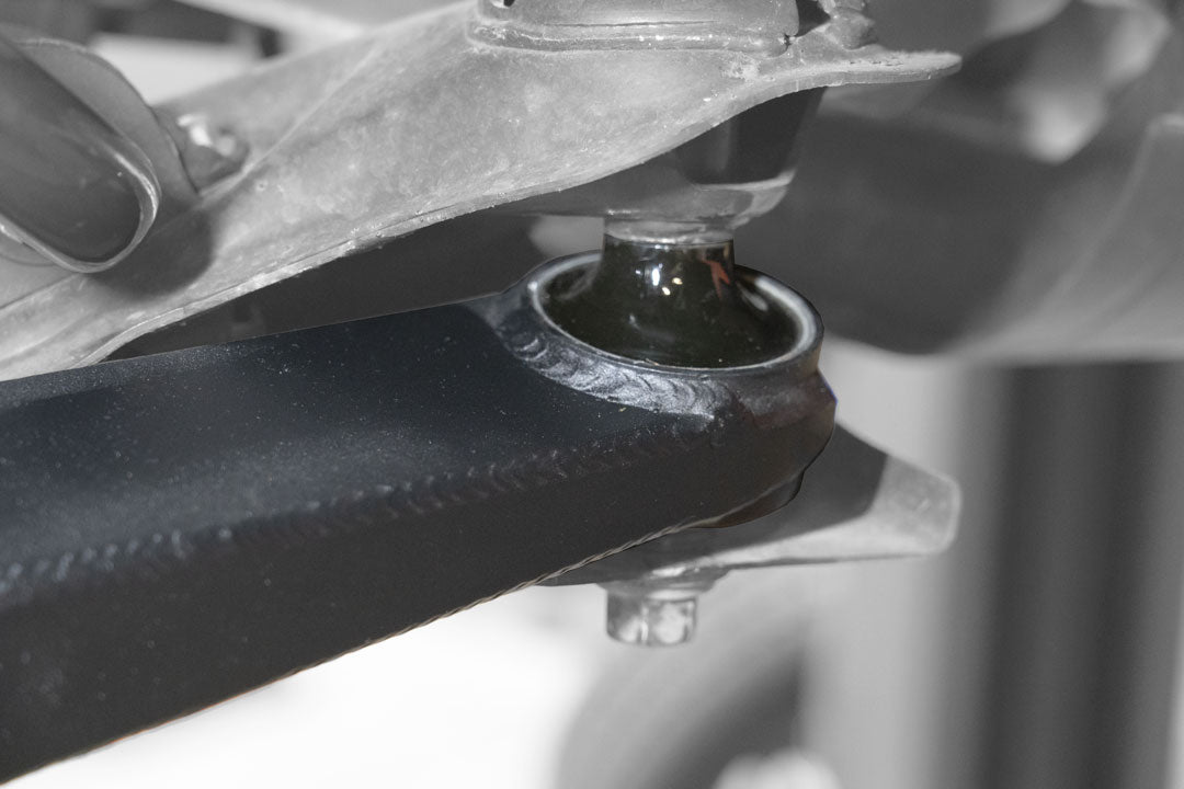 Close-up of the Adjustable High Clearance Lower Control Arm for Transit AWD and RWD (2020-Present), showcasing its robust, precision-engineered metal design.