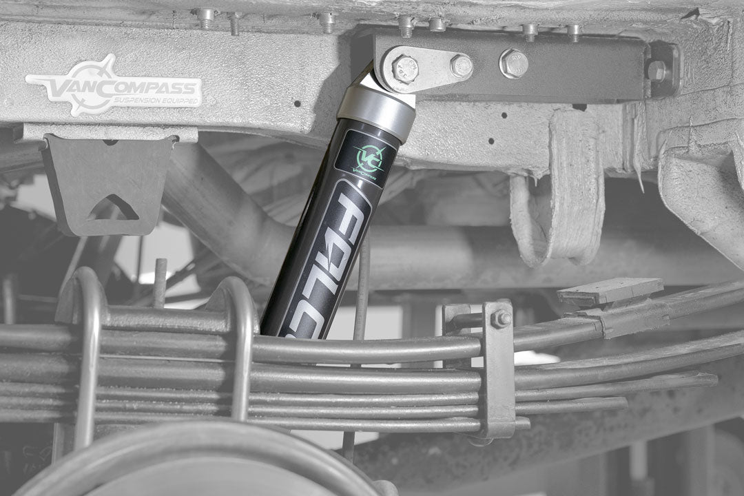 STAGE 1 SYSTEM - SPRINTER 4X4 (2015-18 2500) by VAN COMPASS, featuring close-up of Falcon 2.1 Monotube shock and metal components for improved van handling and stability.