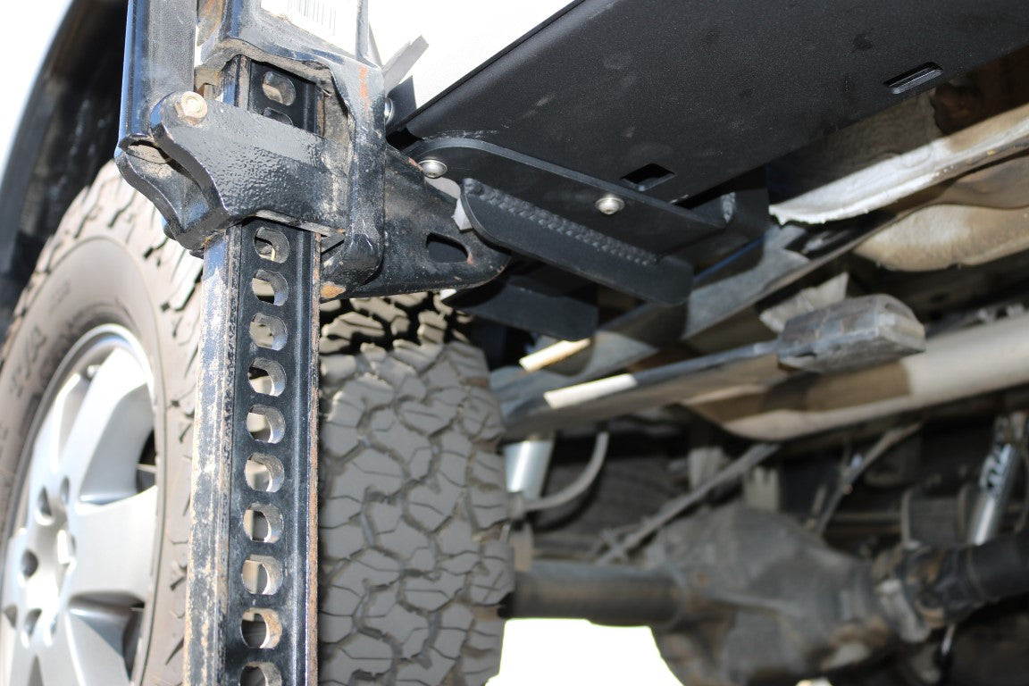 Close-up of Van Compass Rocker Guards for Sprinter AWD 144 wheelbase, showing sturdy metal construction and integrated Hi-Lift jack slots.