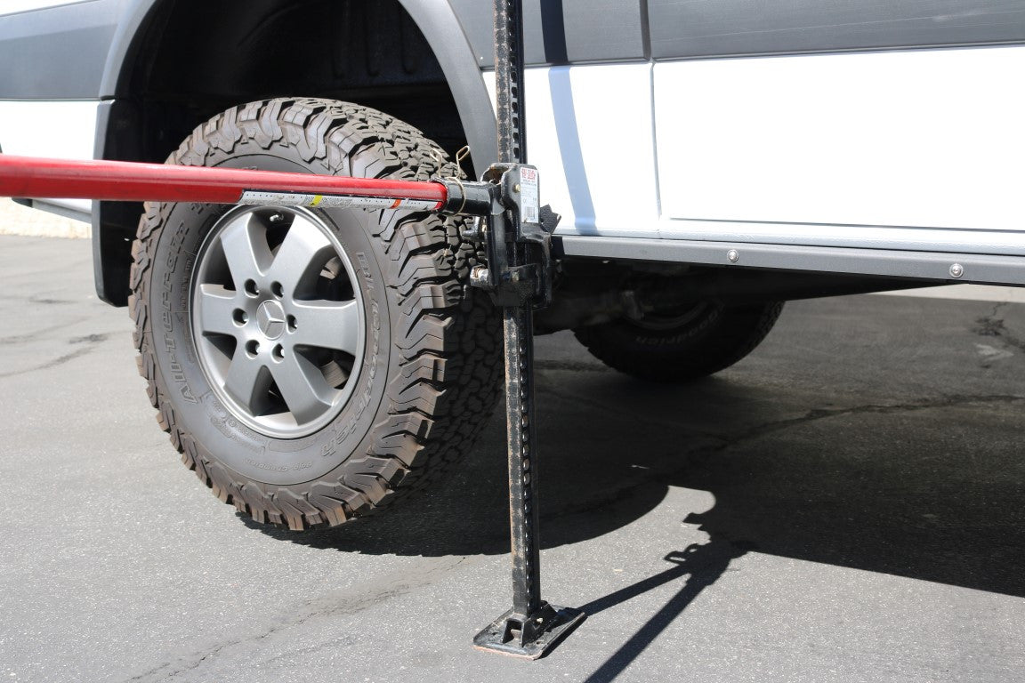 Rocker Guards for Sprinter AWD (2023+ 144 Wheelbase) by Van Compass, shown close-up with integrated Hi-Lift jack slots and robust steel construction for enhanced vehicle protection and accessibility.