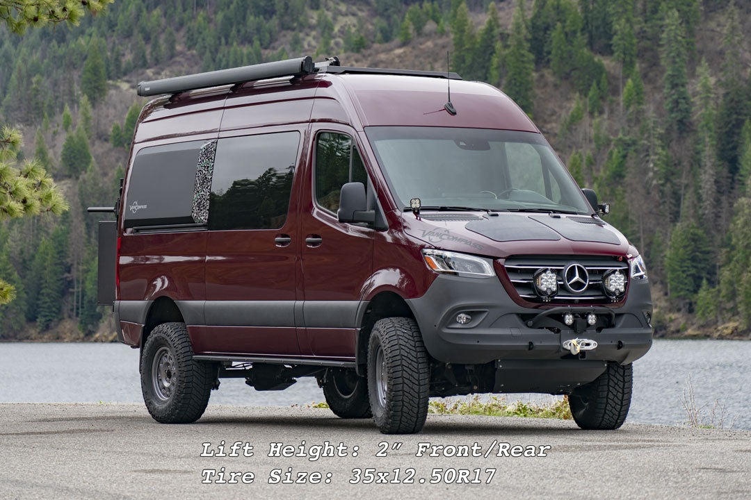 STAGE 6.3 SYSTEM, 2 LIFT for Sprinter 4x4 (2015-2018 2500 ONLY) by VAN COMPASS shown on a red van, highlighting enhanced suspension and larger tires for improved ground clearance.