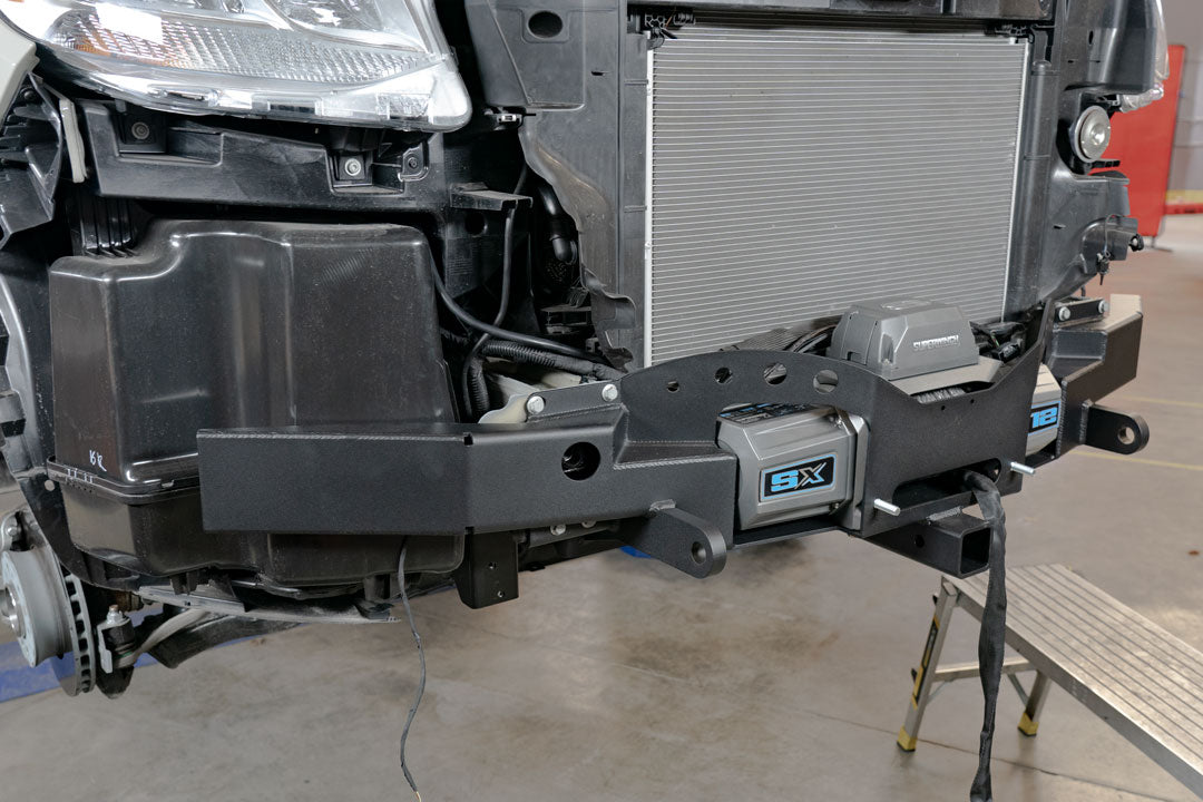 Front view of a car fitted with a VAN COMPASS FRONT WINCH MOUNT WITH BULL BAR - SPRINTER (2019+) showcasing the integrated bull bar and winch points.