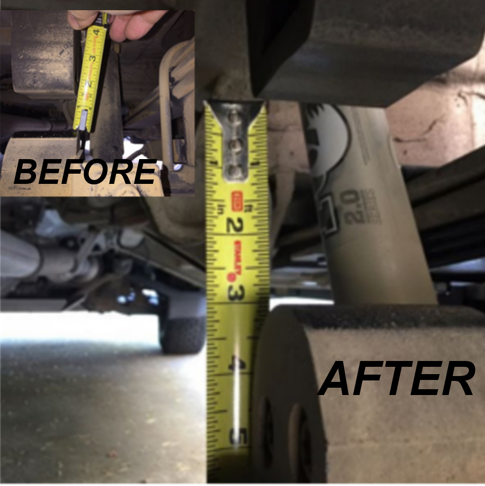 Close-up of REAR MINI SPRING PACK - SPRINTER 2WD (1994+ 2500 ONLY) by VAN COMPASS, showing the yellow measuring tape used for precise installation.