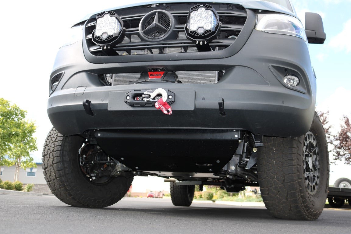 Floating Light Mount for 2019-present Sprinter by Van Compass, shown close-up on vehicle, designed for mounting auxiliary lights with existing mounting points behind the grille.