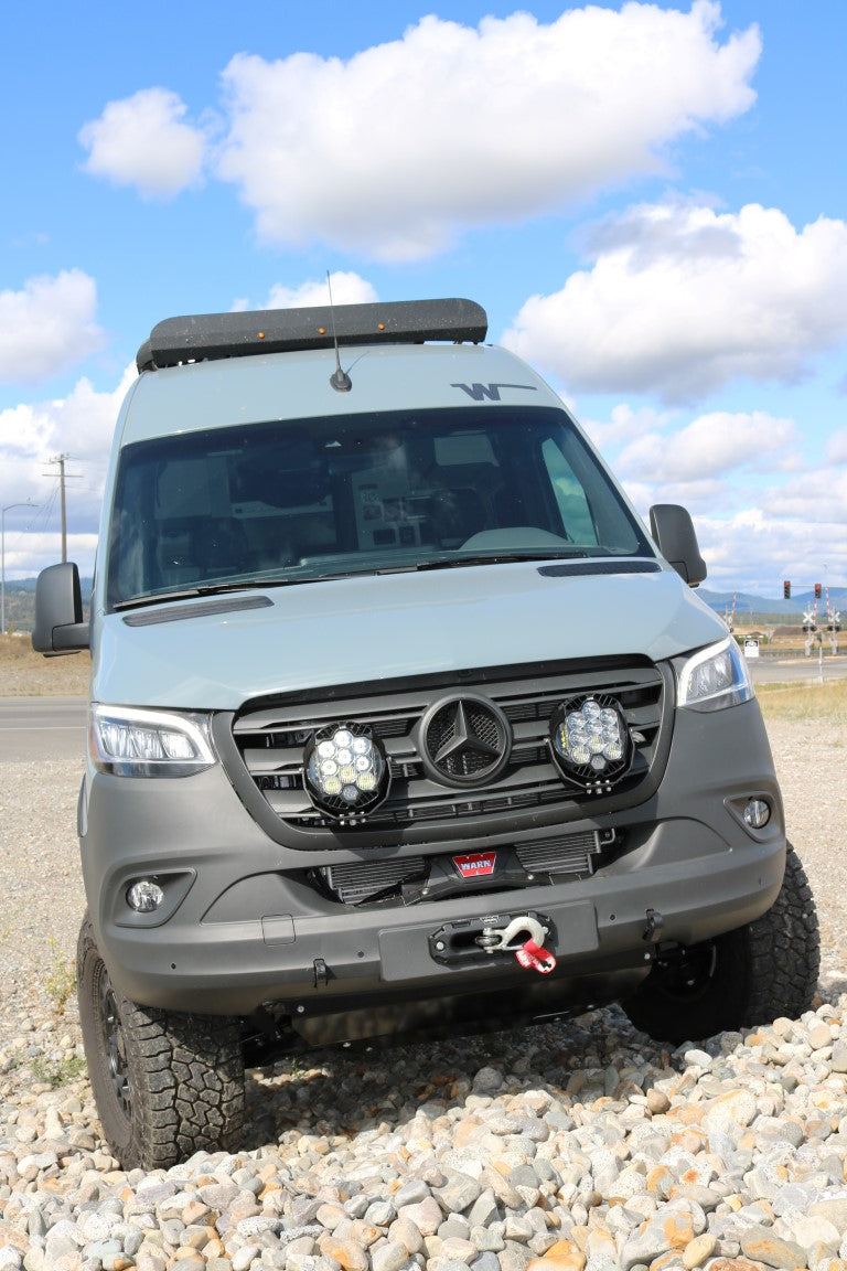 Floating Light Mount for Sprinter (2019-present) by Van Compass, featuring a sleek design that mounts auxiliary lights behind the grill, enhancing vehicle front-end styling and lighting.
