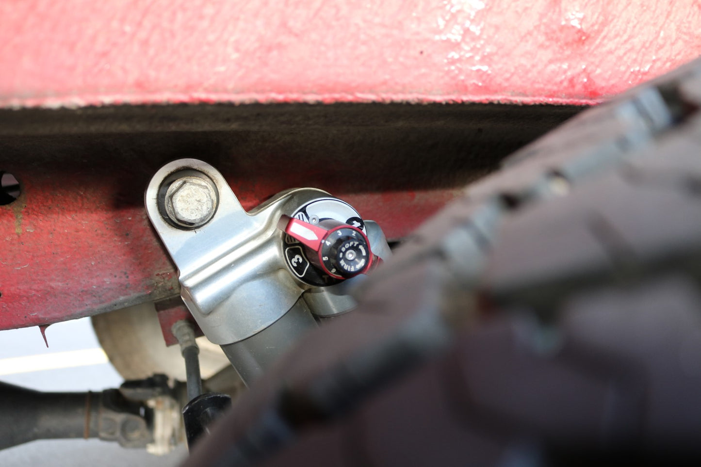 Close-up of FALCON 3.3 SP2 Fast Adjust Rear Shocks for Sprinter 4x4, showing detailed mechanical components and adjustment knob.