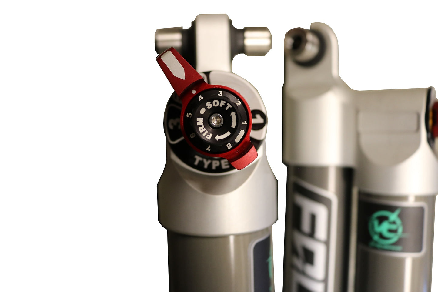 Close-up of the STAGE 2 TOPO 2.0 SYSTEM - TRANSIT AWD (2020+), showing adjustable rear shocks and lift components for improved ride quality and stability.