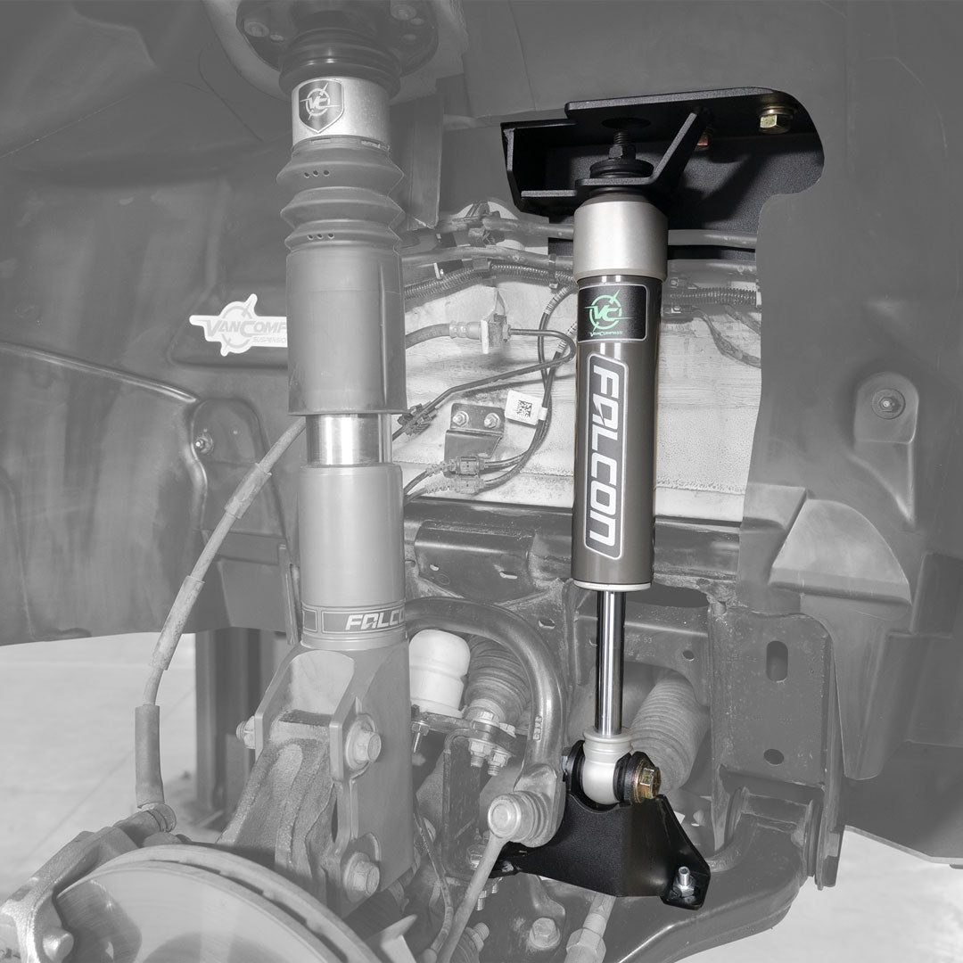 Close-up of VAN COMPASS STAGE 3 OPTI-RATE DUALLY SYSTEM for Sprinter AWD, showcasing Falcon 2.1 Monotube shocks and Opti-Rate springs, enhancing vehicle handling and stability.