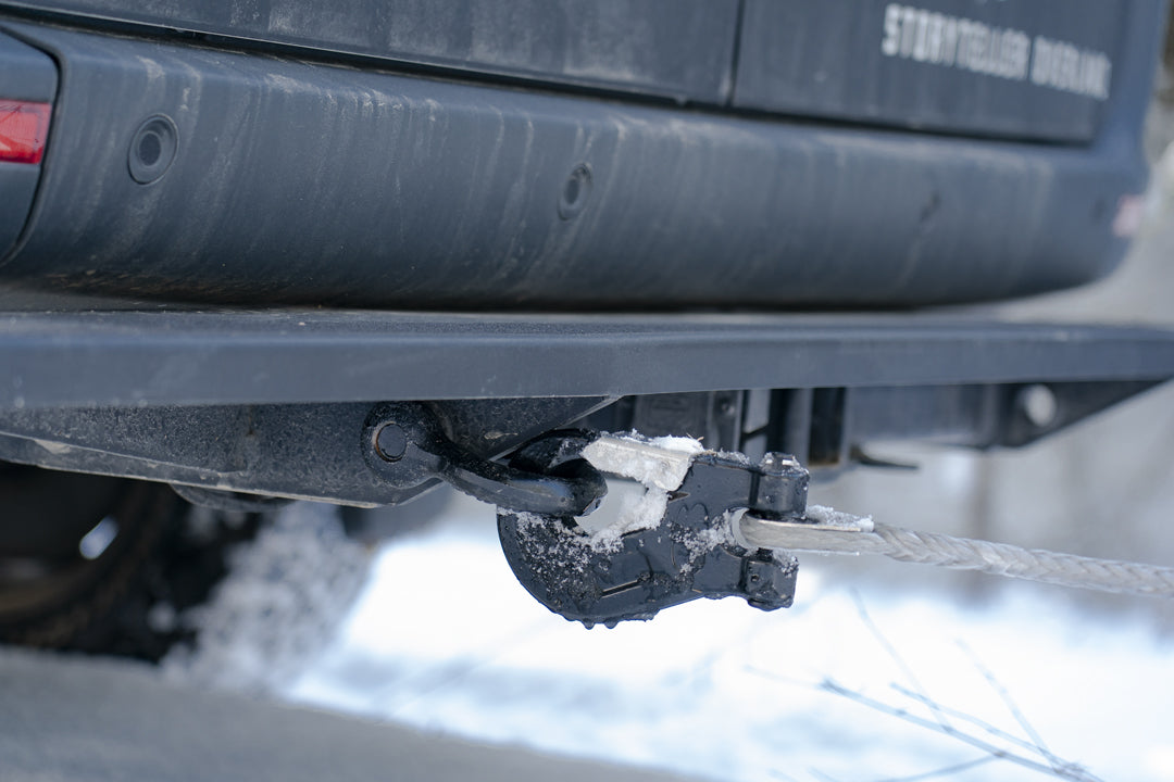 Close-up of the REAR TUG STEP - SPRINTER (2019+) by VAN COMPASS, showing a robust, full-width step attached to the vehicle's rear hitch for easier cargo access.