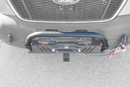 NERF BAR FOR HD WINCH MOUNT - TRANSIT (2015+) by VAN COMPASS, showing a close-up of a black bumper with an attached rope and visible winch components.