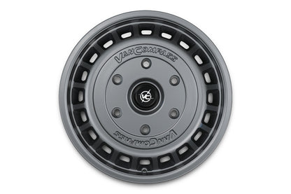 A dark gray metallic Van Compass wheel, shown from a top-down perspective on a solid white background.