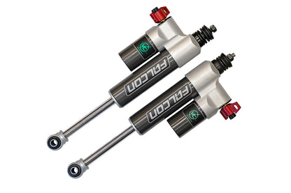 Pair of Falcon 3.3 Fast Adjust Front Shocks for Sprinter 4x4, featuring black and silver cylinders with red adjustment knobs.