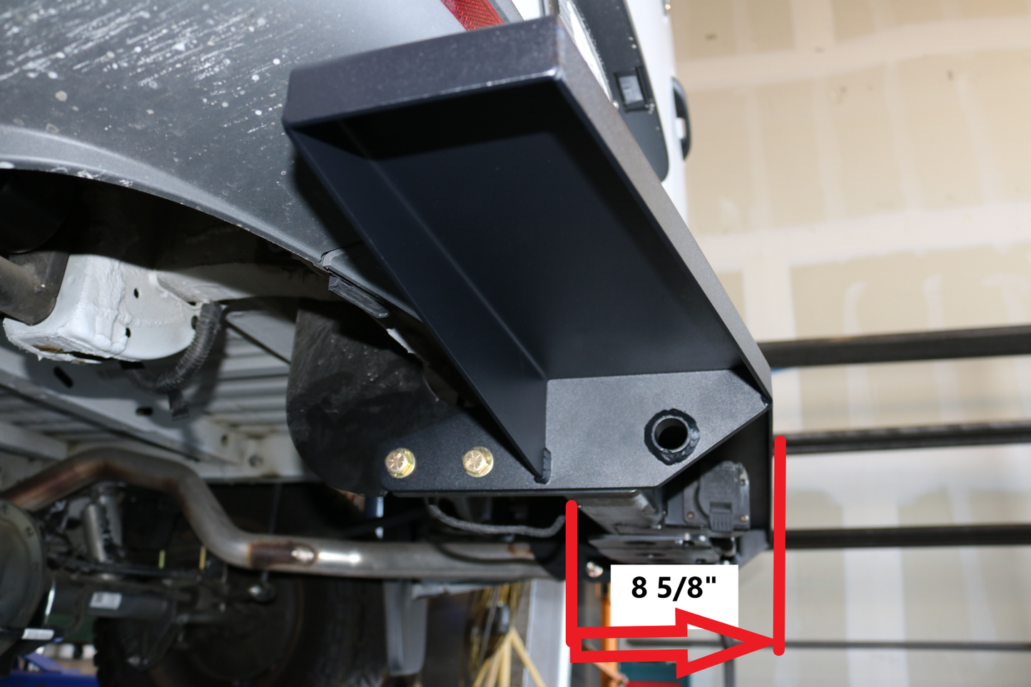 Close-up of the REAR TUG STEP - SPRINTER (2019+) by VAN COMPASS, featuring durable metal construction and bolt on attachments for easy installation on the Mercedes Sprinter VS30.