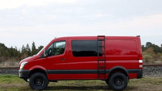 Side ladder for Sprinter vans (2007-current, low roof), mounted on a red van with a ladder attached to the roof ledge, no drilling required.