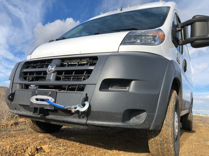 HIDDEN WINCH MOUNT - 2013-2022 RAM PROMASTER by VAN COMPASS: A white van with a blue winch rope attached to the front bumper, displaying robust mounting hardware.