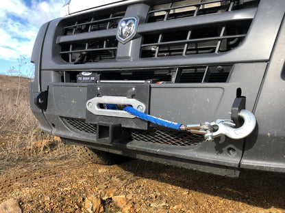 HIDDEN WINCH MOUNT - 2013-2022 RAM PROMASTER by VAN COMPASS: Close-up of a truck’s front winch mount system with visible tow hook and shackle anchor points.