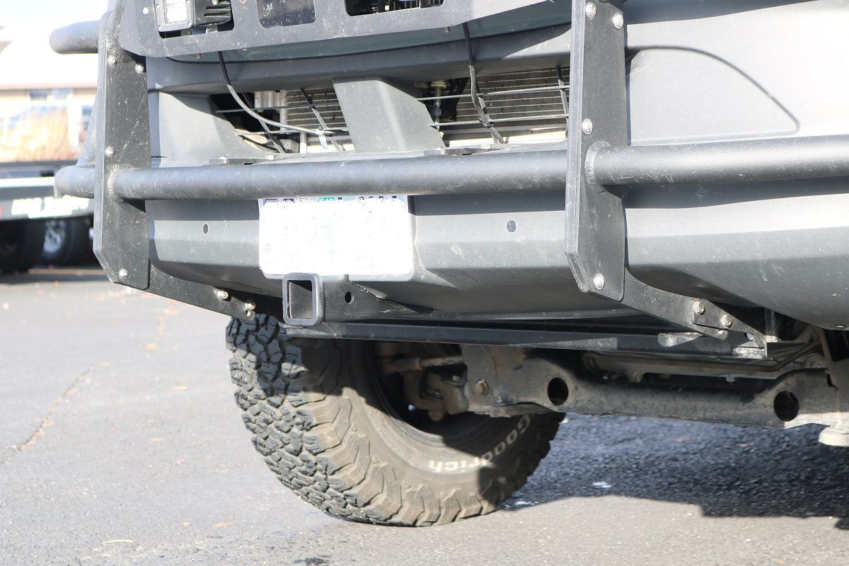 Front view of the Van Compass Front Receiver Hitch for Sprinter (2015+), showcasing its robust steel construction and compatibility with adaptive cruise control and parking sensors.