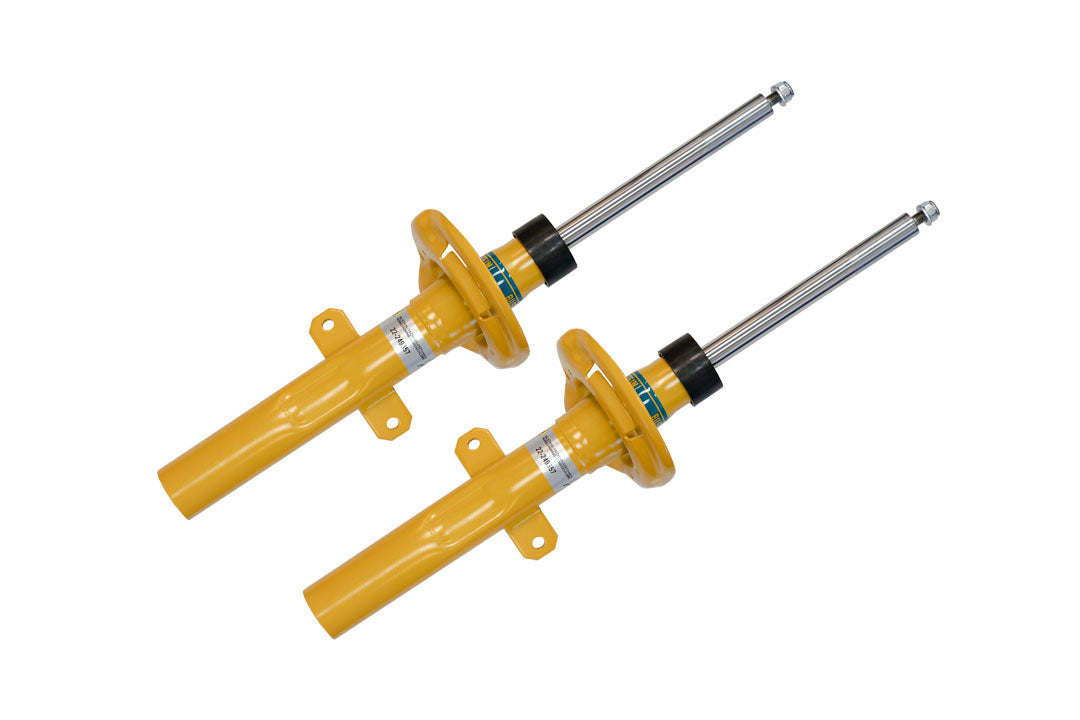 STAGE 1 TOPO 2.0 SYSTEM - TRANSIT RWD by VAN COMPASS: Pair of yellow shock absorbers for improved handling and ride quality in Ford Transit vans.